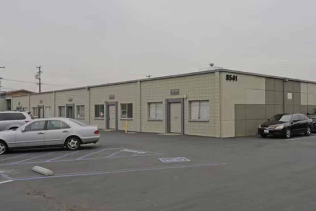 Multiple offices and cars parked